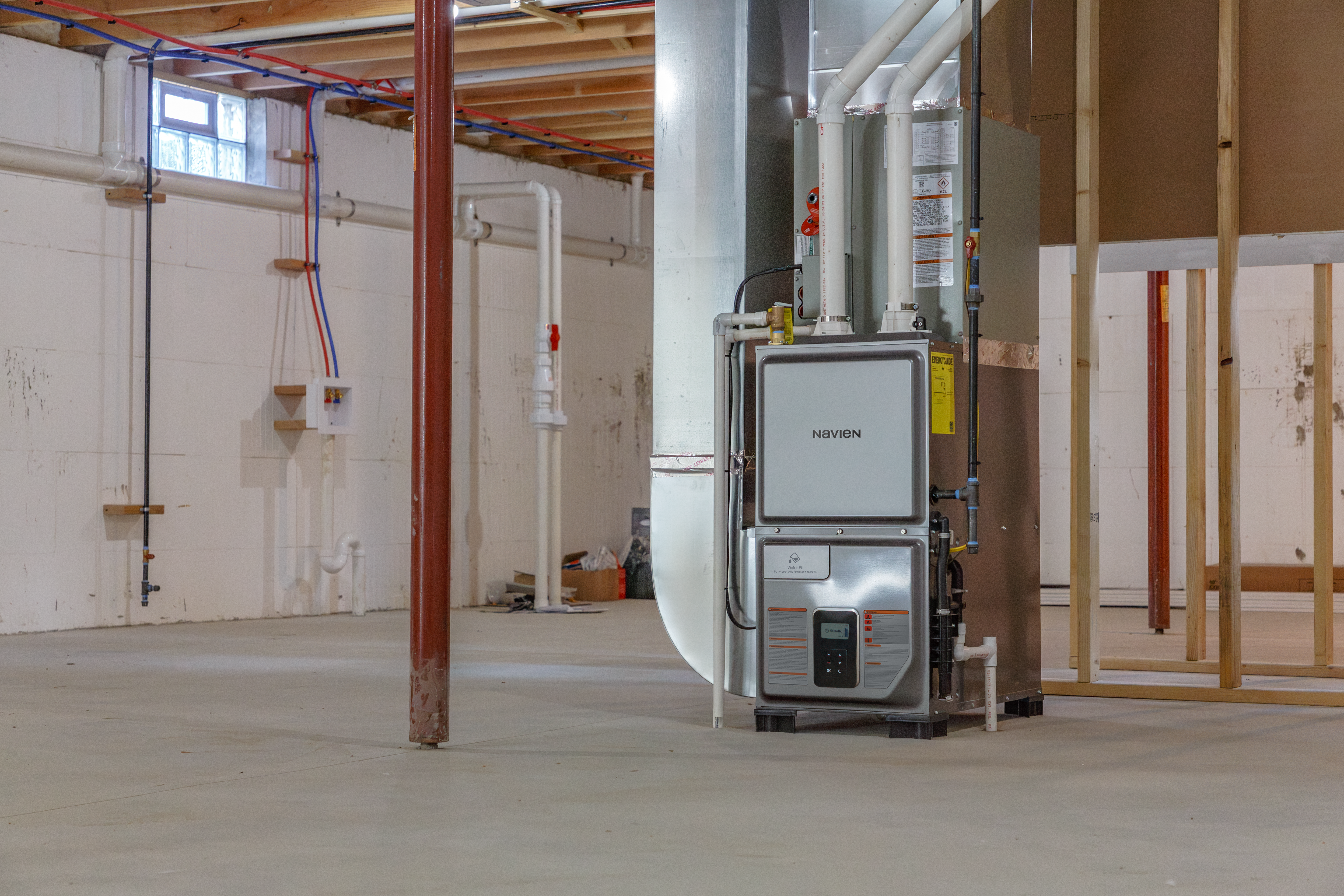 Navien’s tankless water heater system at work in the basement of a residential tower in Burnaby, BC